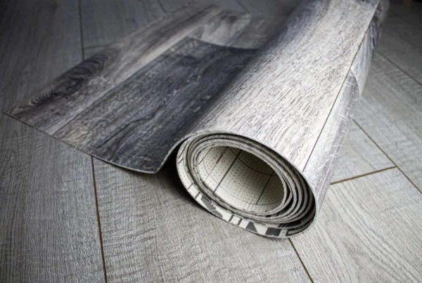 Close-up of a rolled vinyl flooring design with wood-like texture